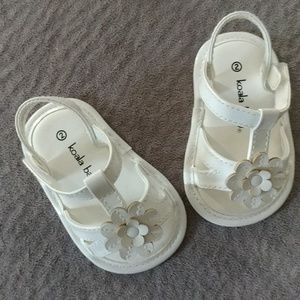 Tiny patent leather sandals